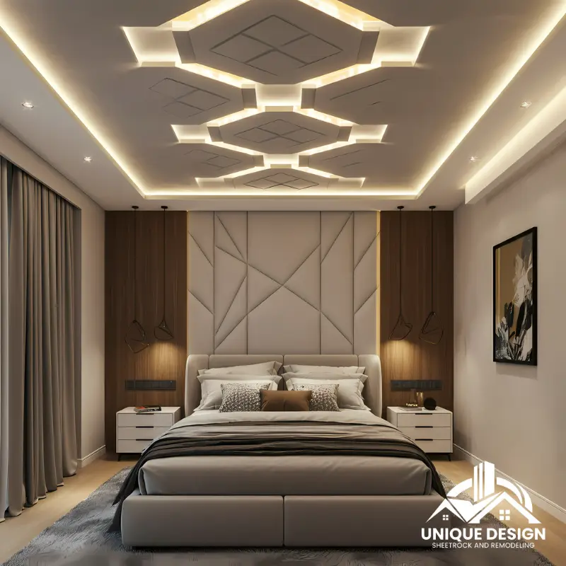 Luxurious bedroom with an intricate geometric ceiling design, LED lighting, and a plush upholstered headboard.